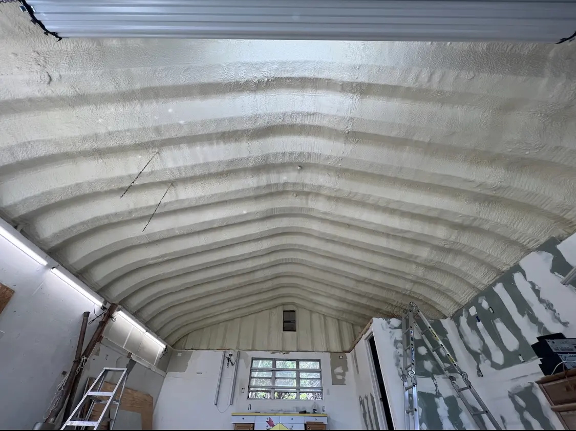 Spray polyurethane foam applied to the underside of a metal roof deck in Church Hill